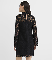 A woman wearing a long-sleeved black lace dress stands with her back to the camera against a plain white background. carousel Product Image 3