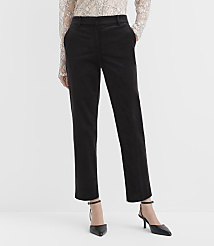 A person wearing a lace top, black trousers, and black pointed-toe heels stands against a plain white background. carousel Product Image 2