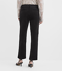 A person wearing a lace top, black trousers, and black heels stands against a plain white background. carousel Product Image 2