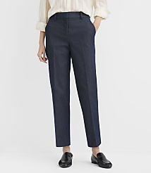 A person wearing a white blouse, navy blue trousers, and black loafers stands against a plain white background. carousel Product Image 2
