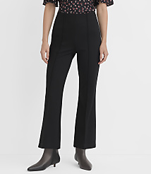 A person stands in black flared pants and pointed-toe boots against a plain white background. carousel Product Image 2