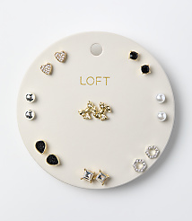 Various pairs of stud earrings are arranged on a circular white LOFT display card against a plain white background. carousel Product Image 1