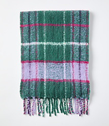 A green, pink, and purple plaid fuzzy scarf with fringed edges lies flat against a plain white background. carousel Product Image 2
