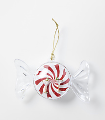 A candy-shaped Christmas ornament with red and white swirls and two martini glasses sits against a plain white background. carousel Product Image 1