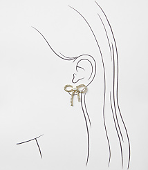A gold bow-shaped earring with crystals sits on a simple line drawing of a woman's profile against a plain white background. carousel Product Image 2