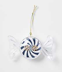 A candy-shaped Christmas ornament with blue and white stripes and gold snowflakes hangs by a gold string against a plain white background. carousel Product Image 1