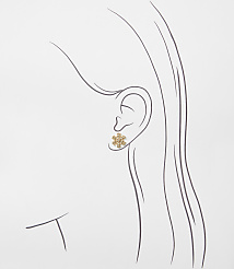 A gold snowflake earring is positioned on a minimalist line drawing of a woman's profile against a plain white background. carousel Product Image 2
