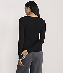 A woman wearing a black long-sleeved shirt and grey pants stands with her back to the camera against a plain white background. carousel Product Image 3