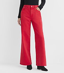 A person wearing bright red flared jeans and black boots stands against a plain white background. carousel Product Image 2