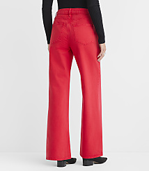 A person wearing bright red wide-leg jeans stands against a plain white background. carousel Product Image 3
