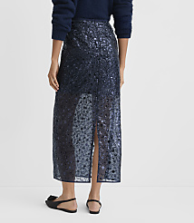 A person wearing a navy blue sequined skirt and a fuzzy sweater stands against a plain white background. carousel Product Image 4