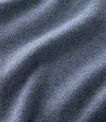 Blue knitted fabric with soft folds in the foreground and a consistent textured weave throughout the background. carousel Product Image 3
