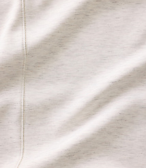 A close-up of a white fabric with a vertical seam in the foreground and soft folds across the background. carousel Product Image 3