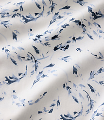 Blue floral patterns are scattered across a white, rippled fabric background. carousel Product Image 4