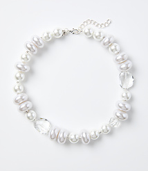 A white pearl and crystal necklace rests on a plain white background. carousel Product Image 1