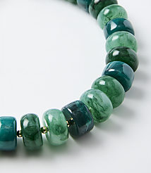 A necklace of marbled green and teal beads rests on a plain white background. carousel Product Image 2