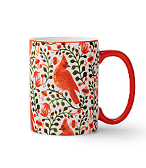 A white mug featuring red cardinals and green foliage stands against a plain white background. carousel Product Image 1