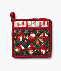 A red quilted pot holder with a teddy bear pattern sits against a plain white background. carousel Product Image 1
