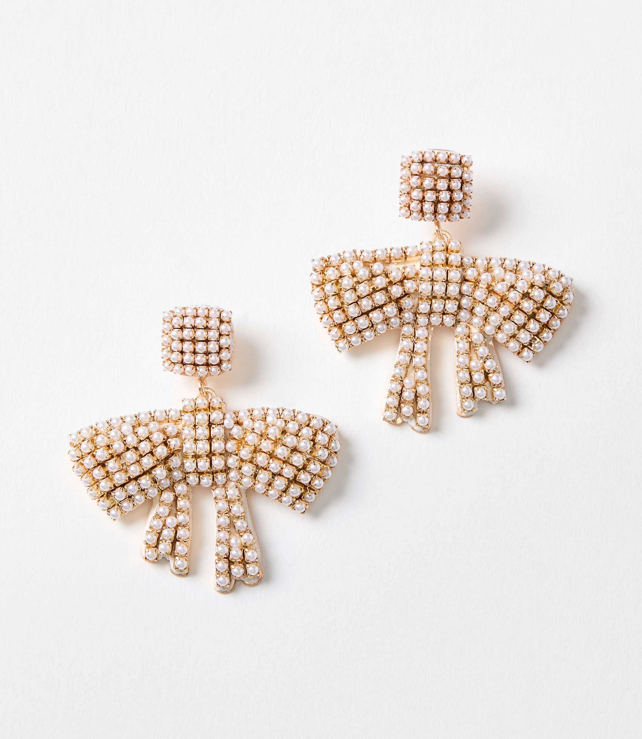 Pearlized Bow Statement Earrings