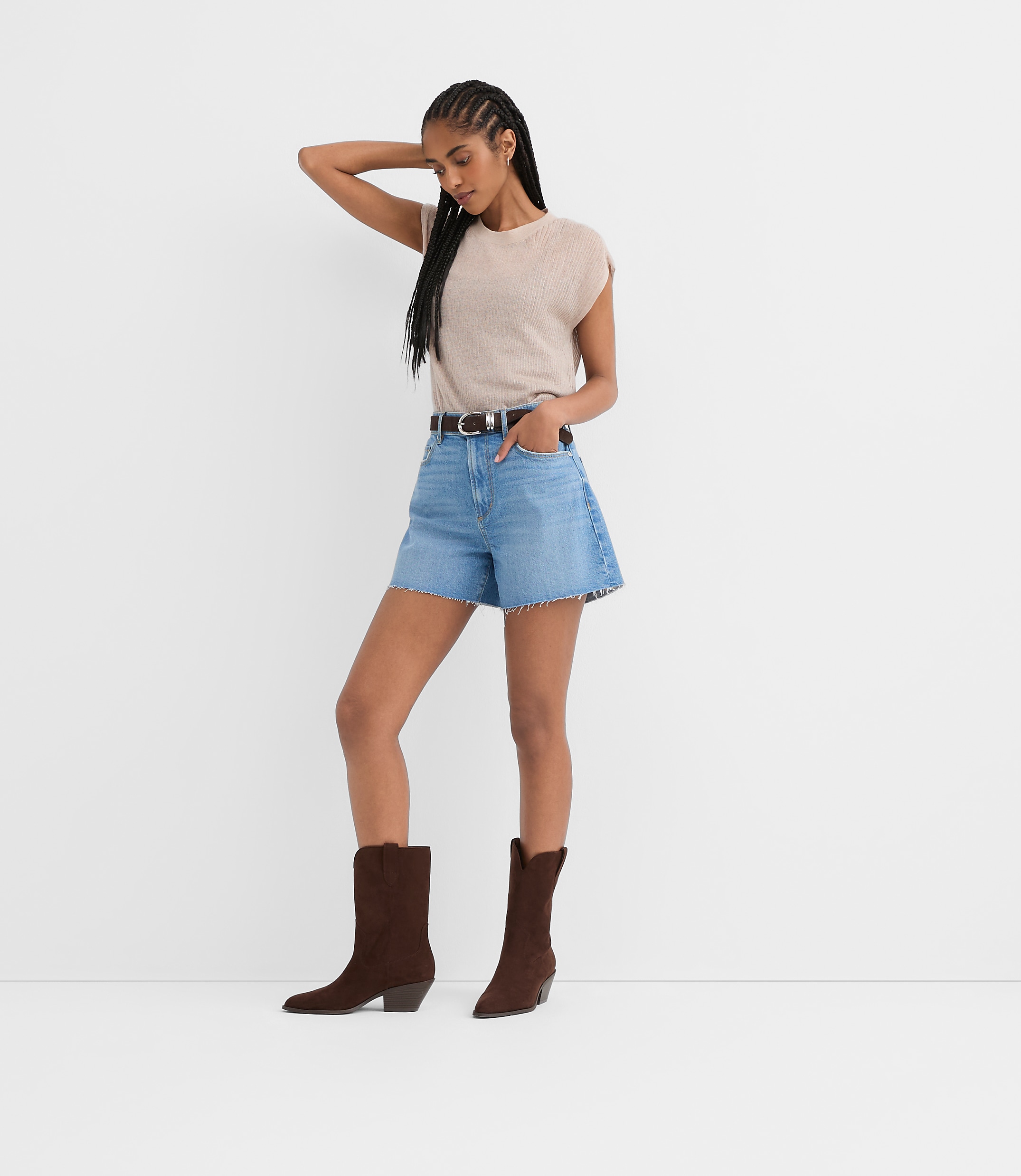 Rivete Petite High Rise Cut Off Denim Shorts in Mid Wash