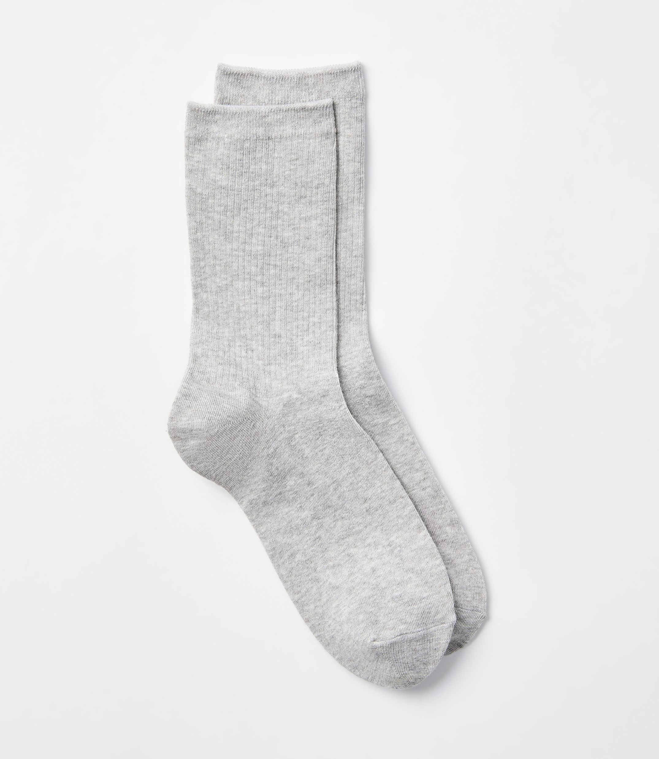 A pair of light gray ribbed socks lies on a plain white background.