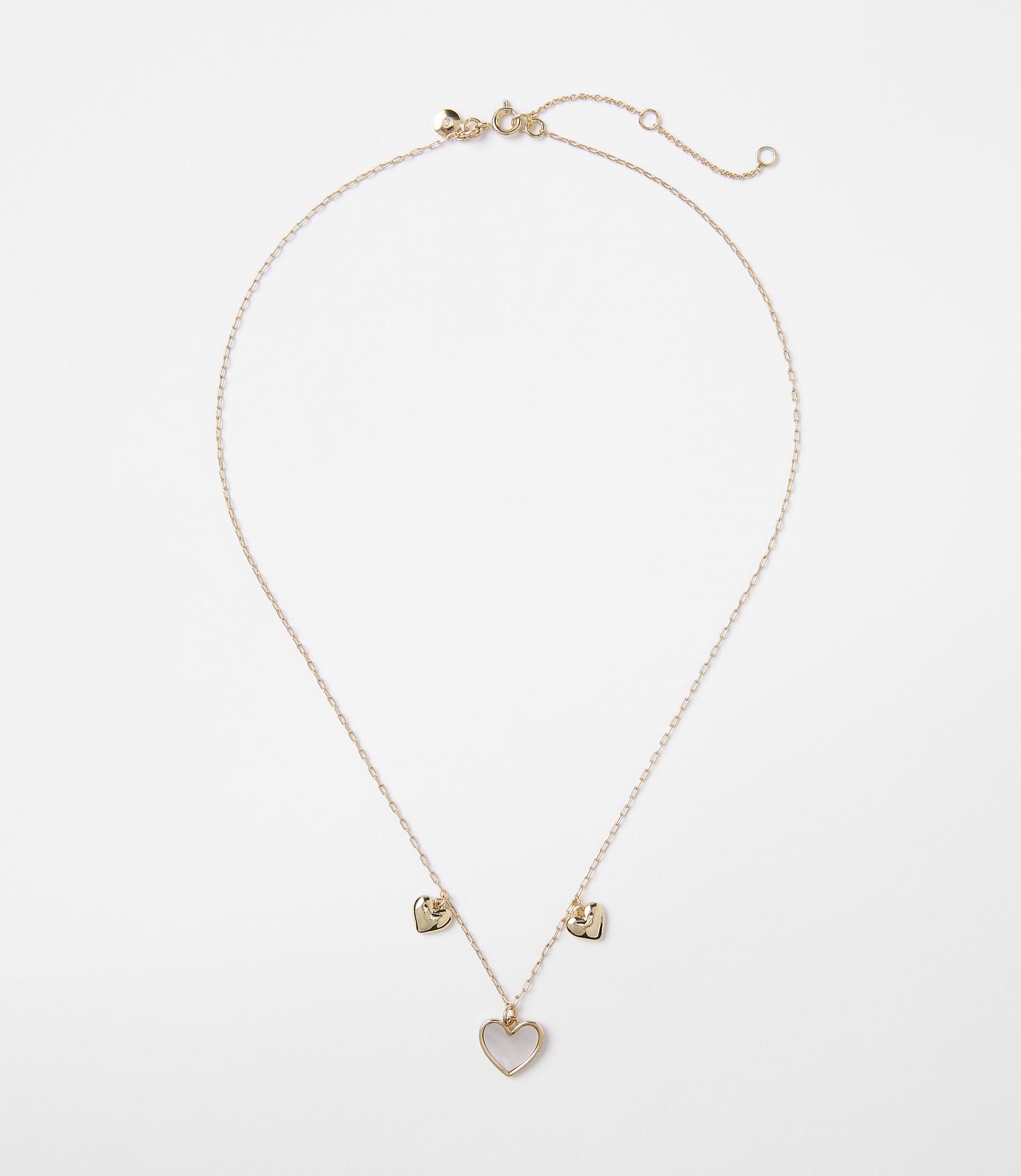 A delicate rose gold necklace with a heart-shaped pendant and two smaller heart charms hangs against a plain white background.