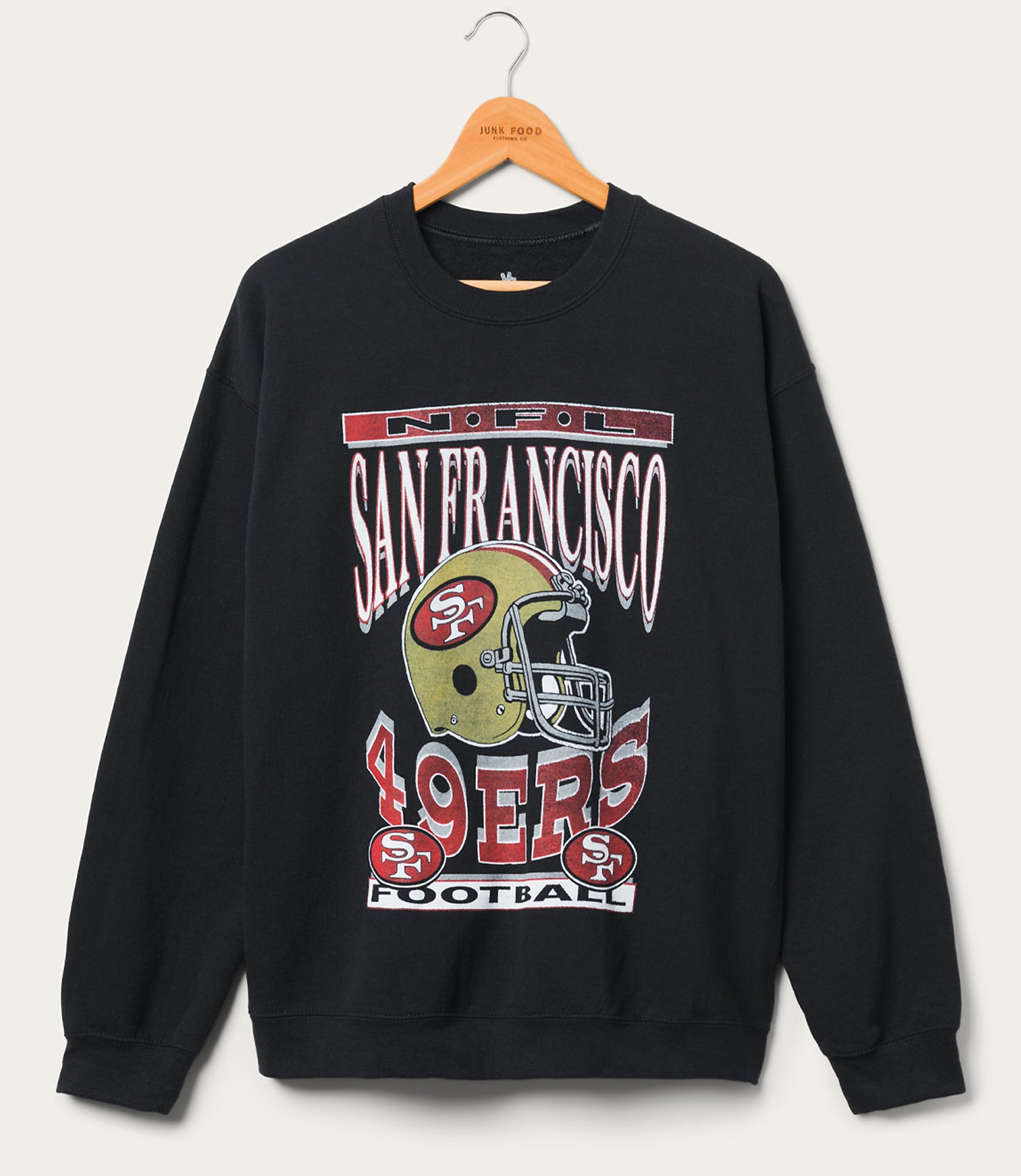 A black San Francisco 49ers sweatshirt with a vintage graphic hangs on a wooden hanger against a plain white background.