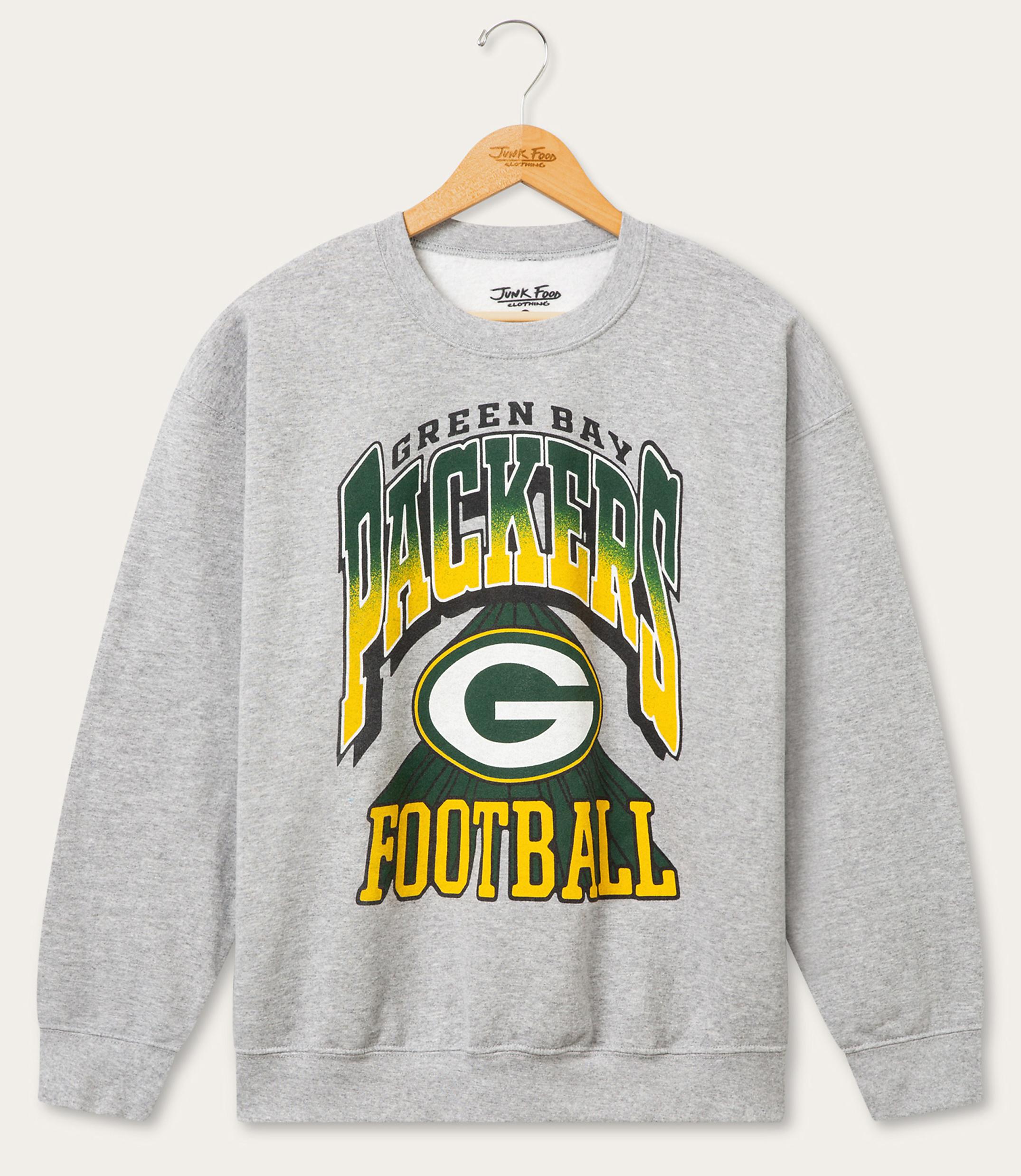 A grey Green Bay Packers sweatshirt with the team's logo and "FOOTBALL" text is displayed against a plain white background.