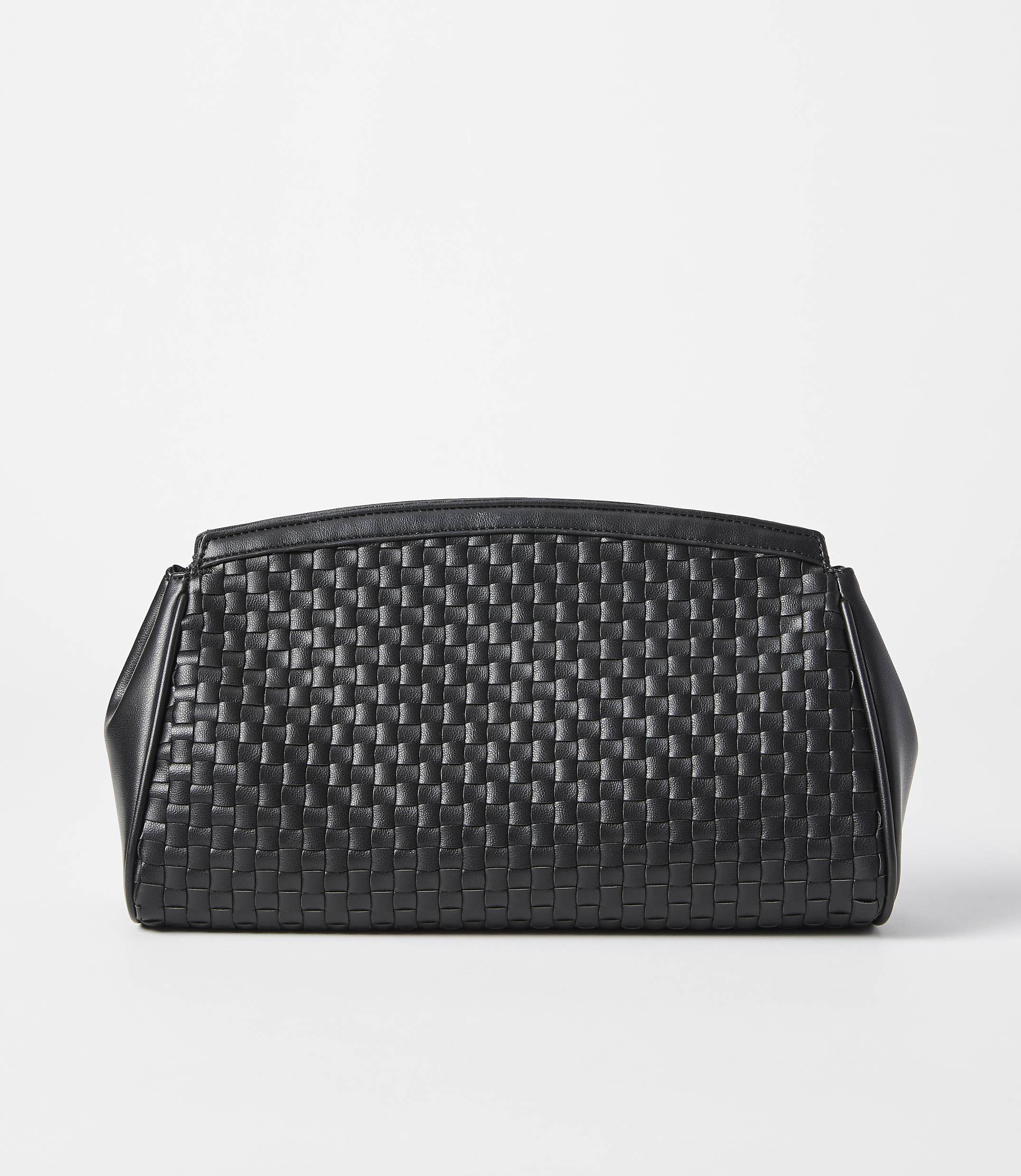 A black woven clutch rests on a white surface against a plain white background.