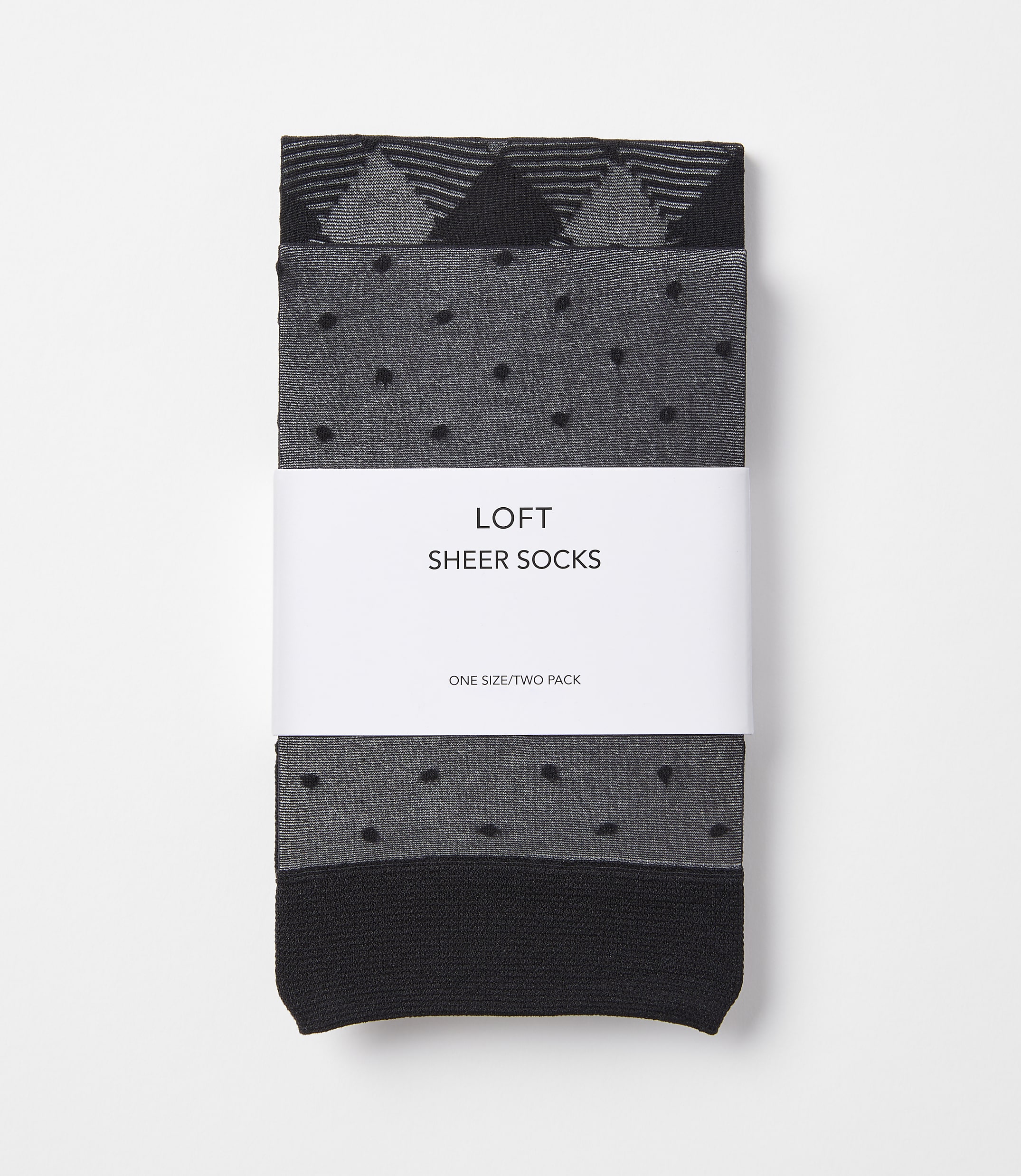 Two pairs of grey and black sheer socks with a geometric pattern and polka dots are neatly packaged with a white band that reads "LOFT SHEER SOCKS" against a plain white background.