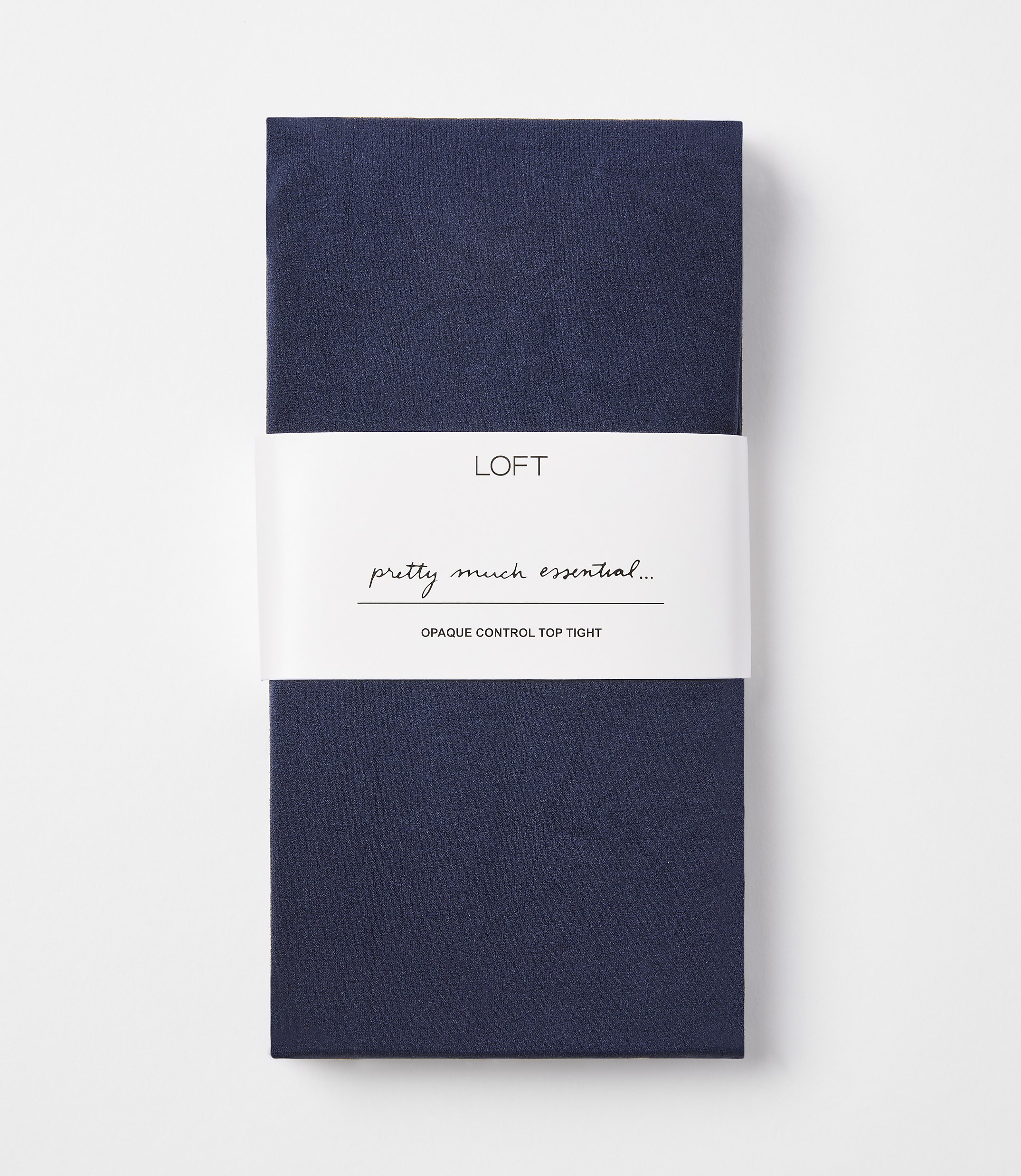 A folded pair of navy blue opaque control top tights with a white band in the middle featuring the "LOFT" logo and text, against a plain white background.