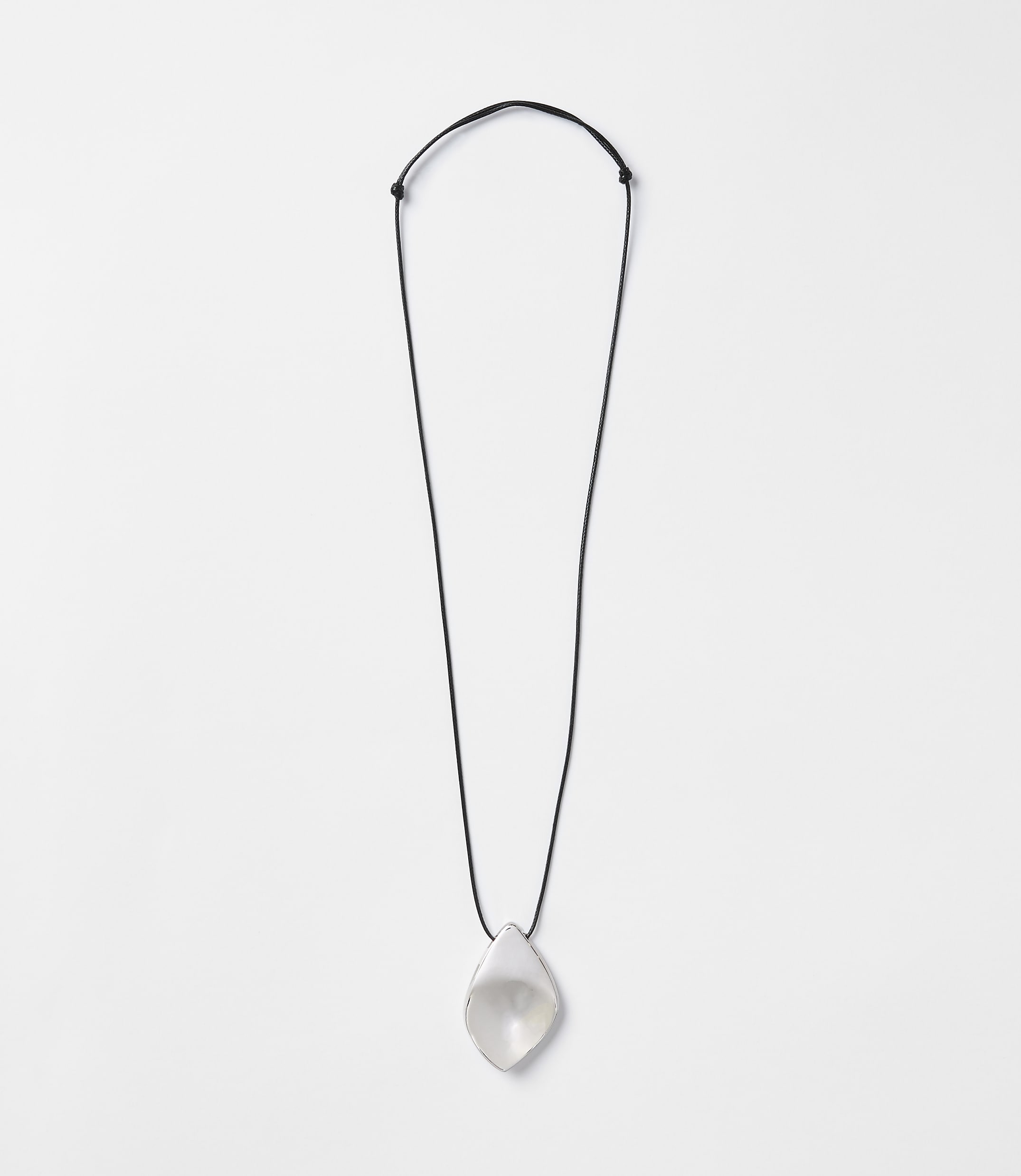 A translucent, teardrop-shaped pendant hangs from a thin black cord against a plain white background.