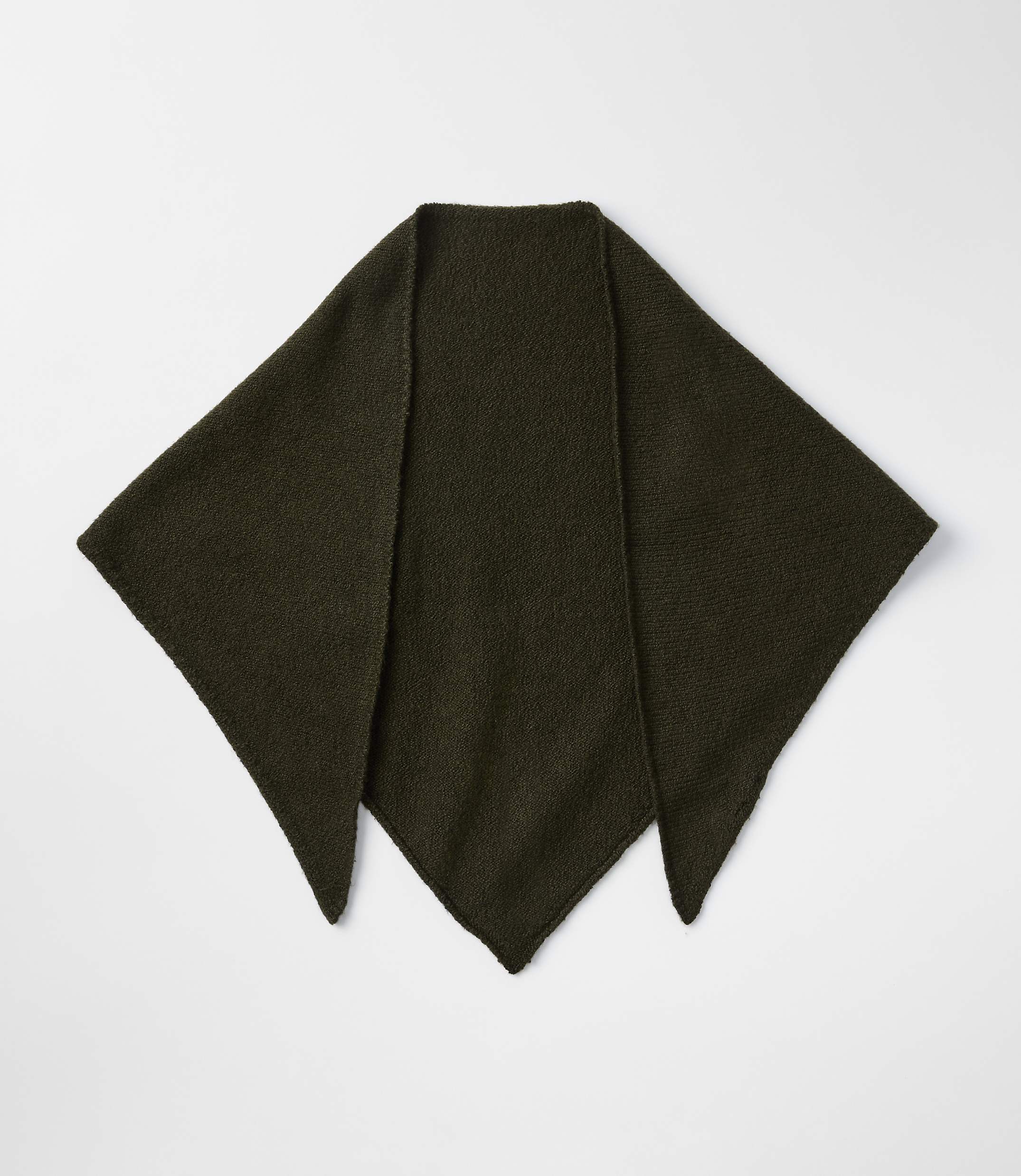 A dark green, knitted triangular shawl lies flat on a plain white background.