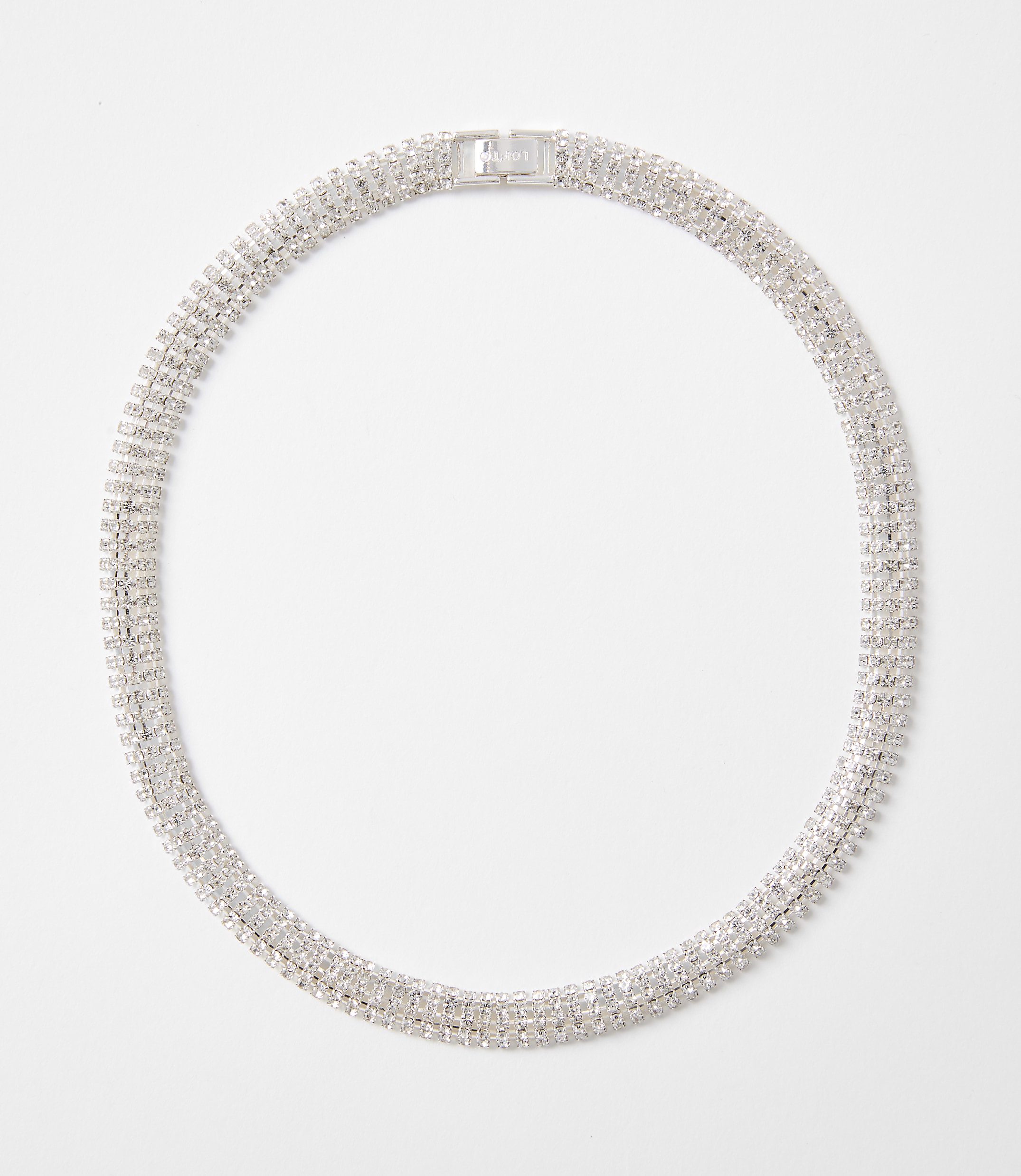 A sparkling, multi-layered rhinestone necklace with a silver clasp rests on a plain white background.