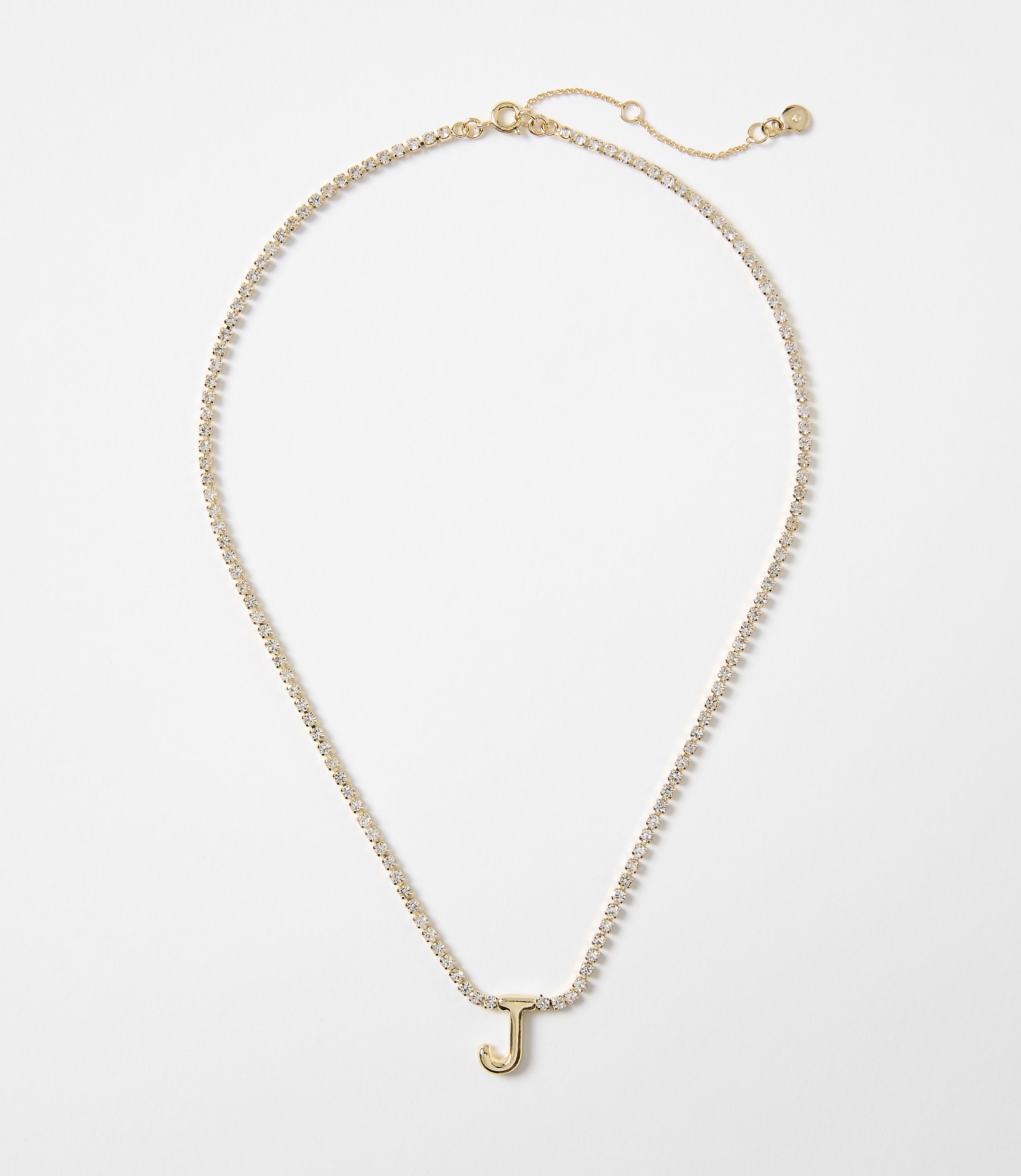 A gold necklace with a single letter "J" charm and a white background.