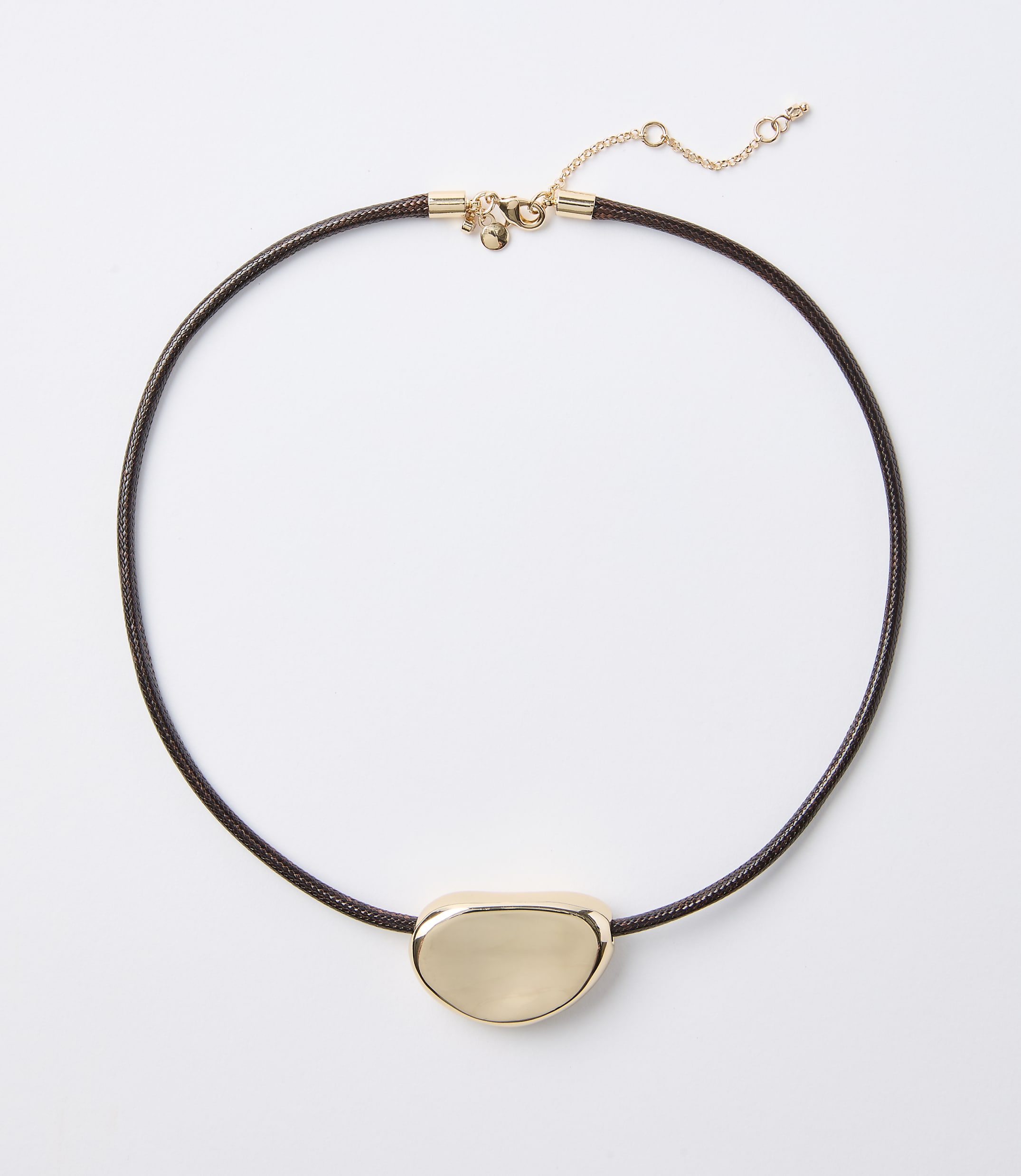 A dark brown cord necklace with a smooth, gold-toned pendant rests on a plain white background.