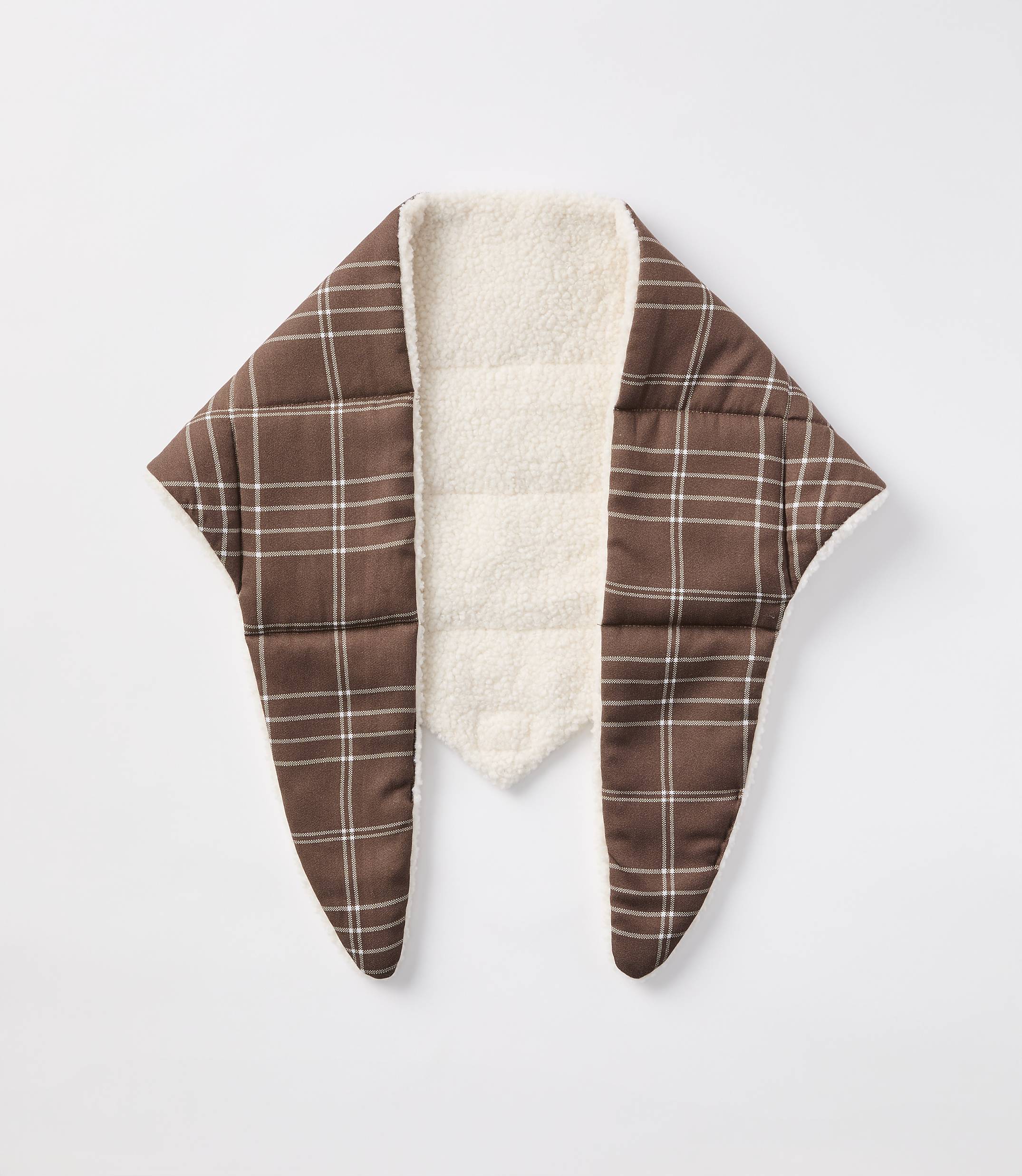 A brown plaid scarf with a cream sherpa lining is laid flat against a plain white background.