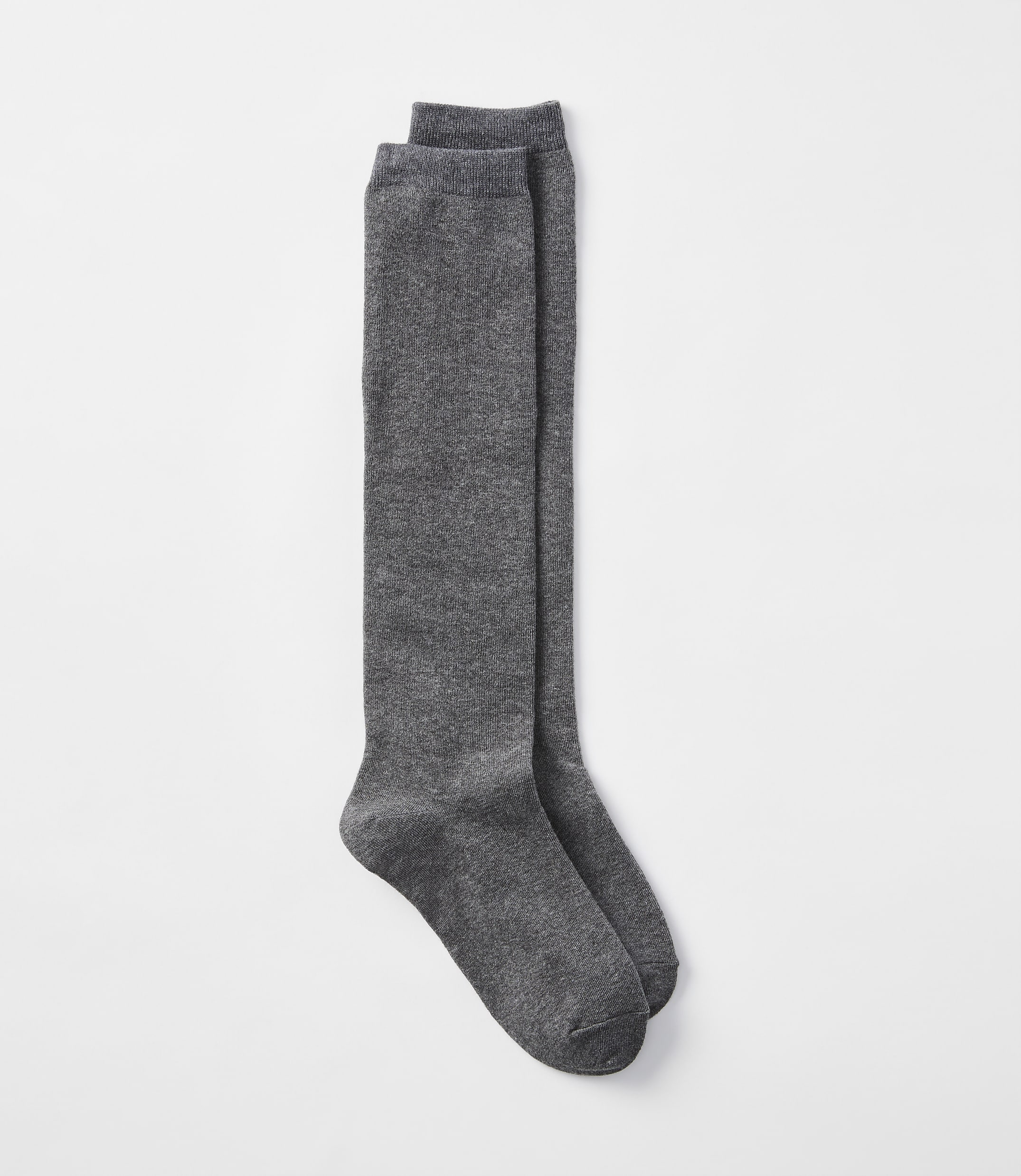 A pair of charcoal gray knee-high socks lies flat against a plain white background.