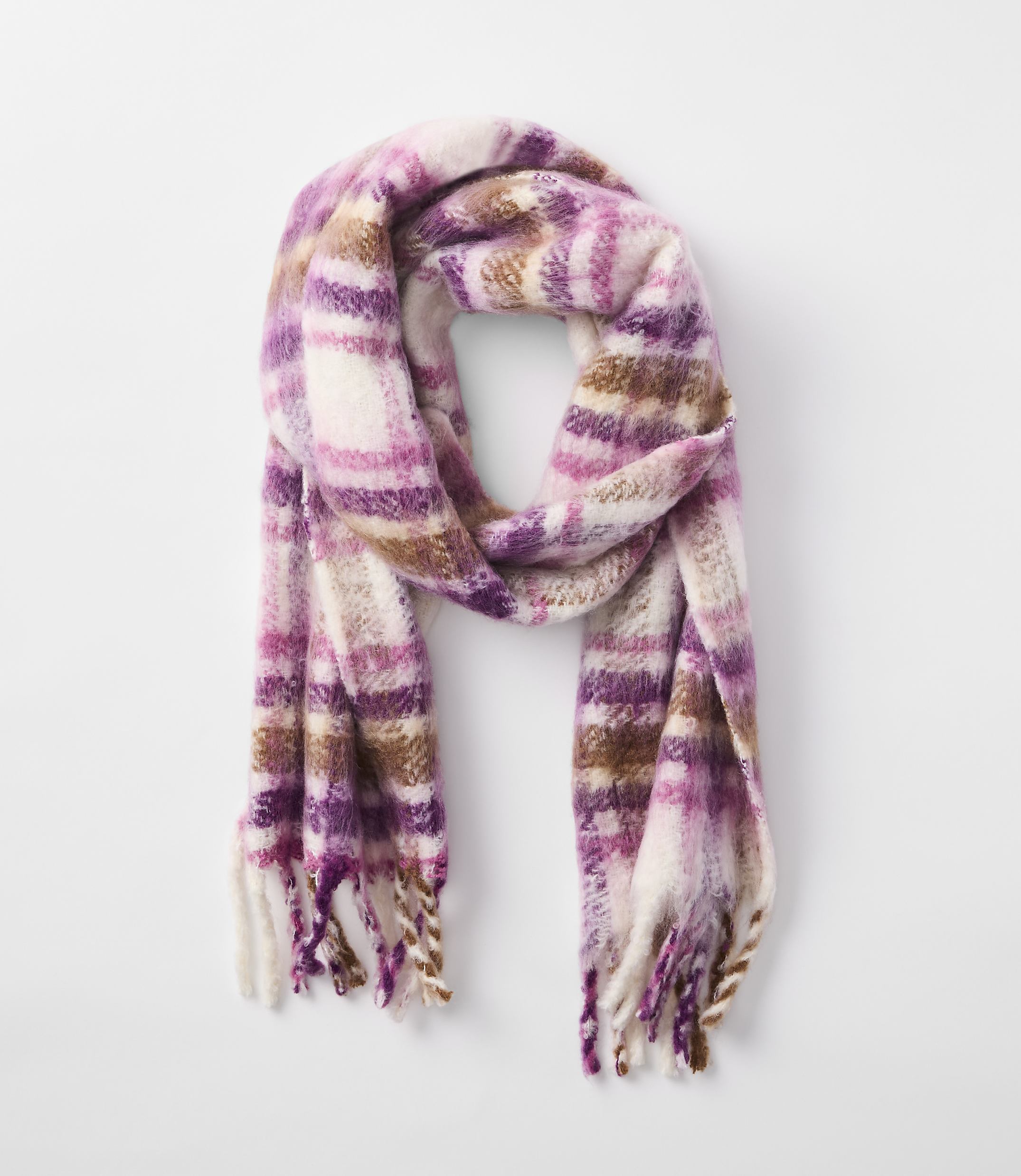 A fuzzy, plaid scarf in shades of pink, purple, and brown hangs against a plain white background.