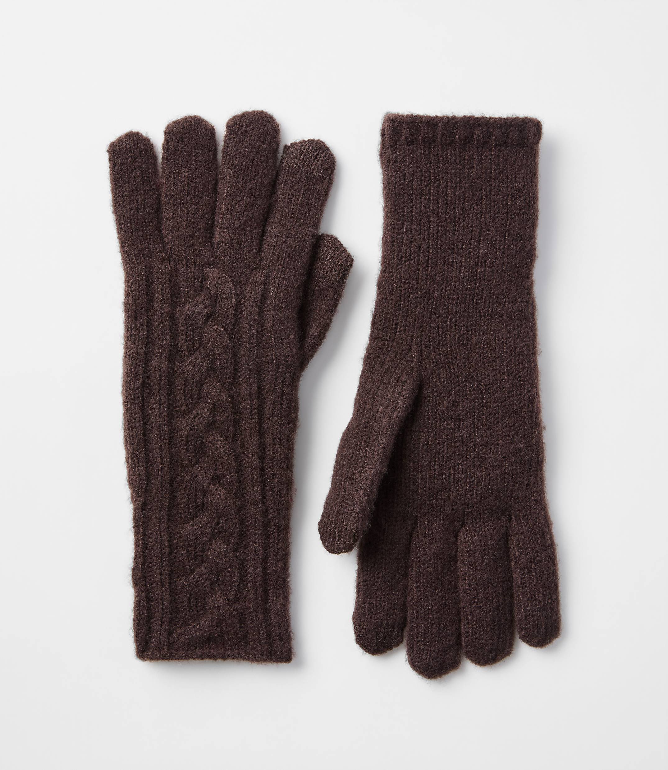 A pair of brown cable-knit gloves with ribbed cuffs rests on a plain white background.
