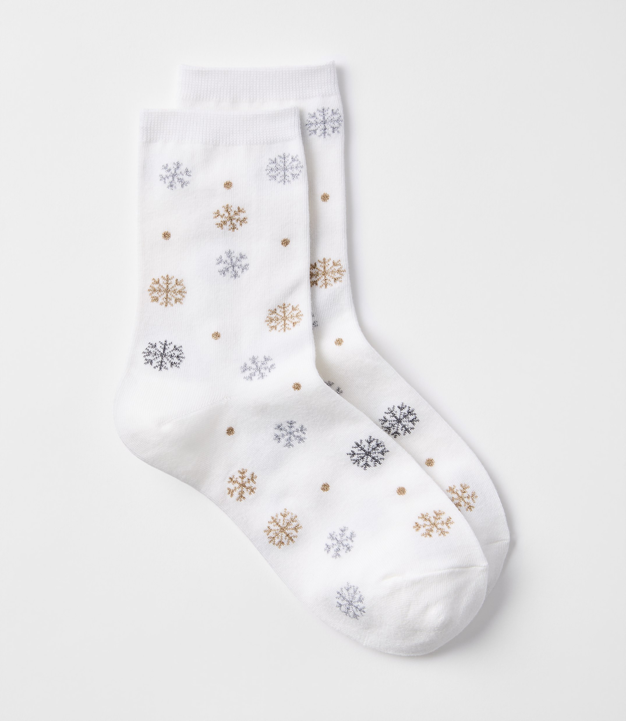 A pair of white socks with a snowflake pattern are laid out against a plain white background.