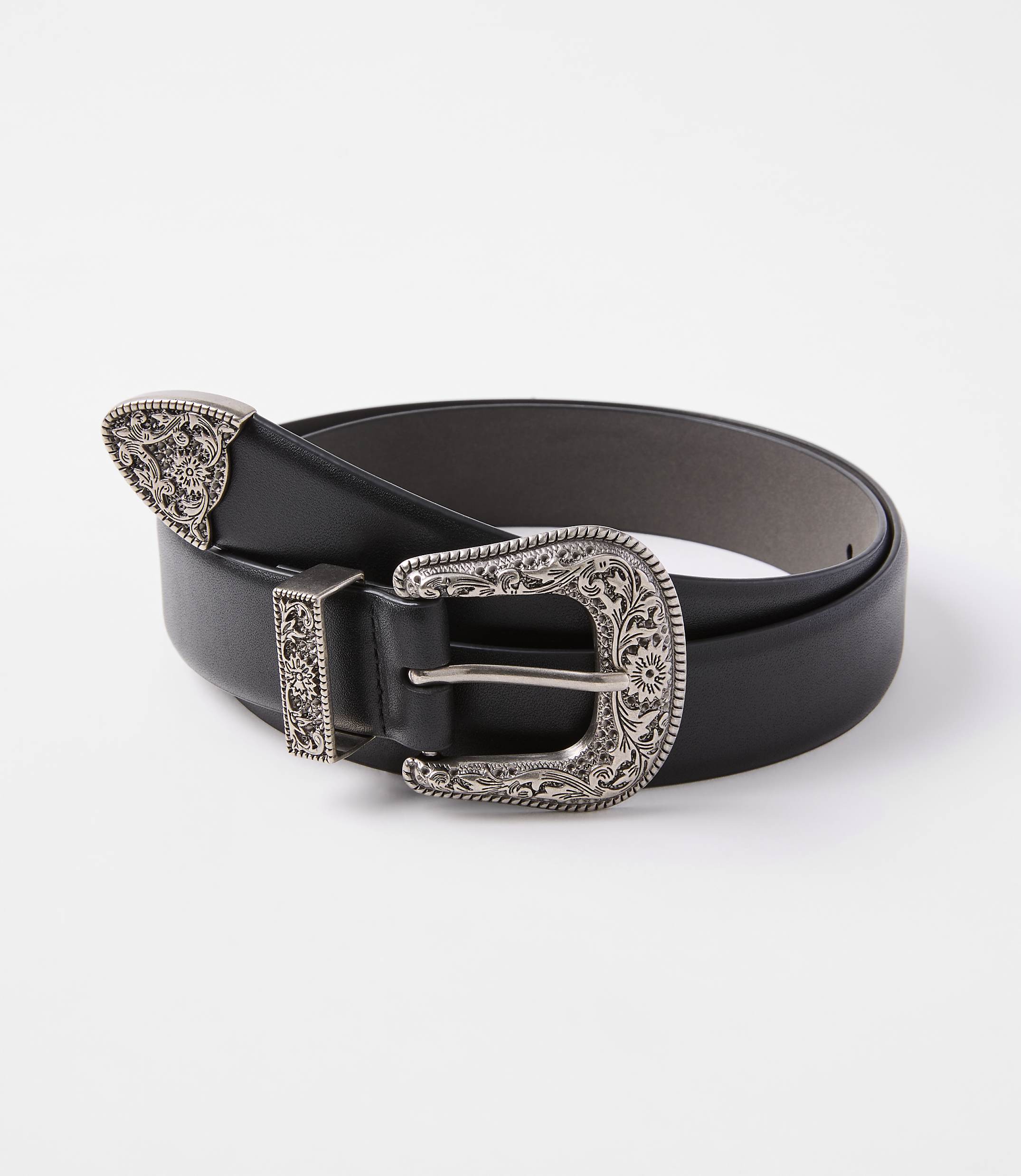 A black leather belt with ornate silver buckle and tip rests on a plain white background.