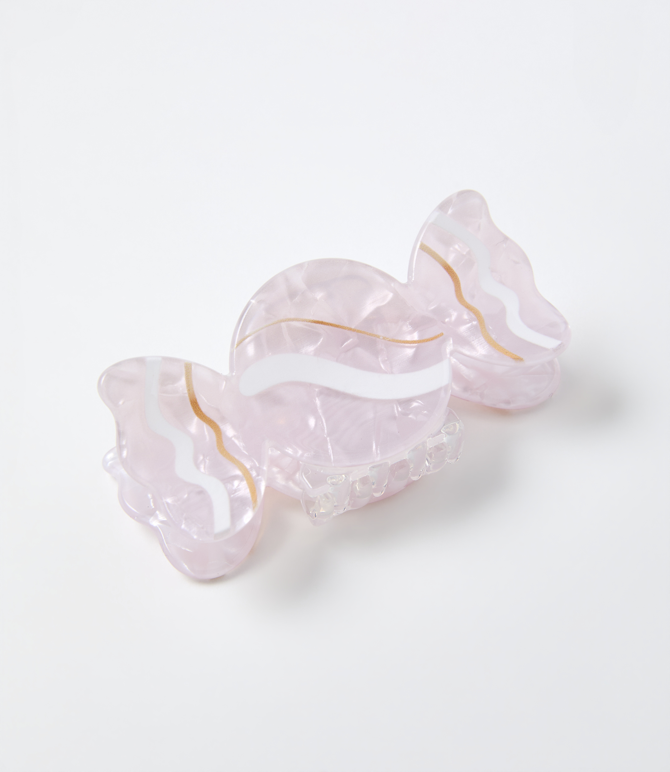 A pink, translucent butterfly-shaped hair claw clip with gold and white wavy accents rests on a plain white background.