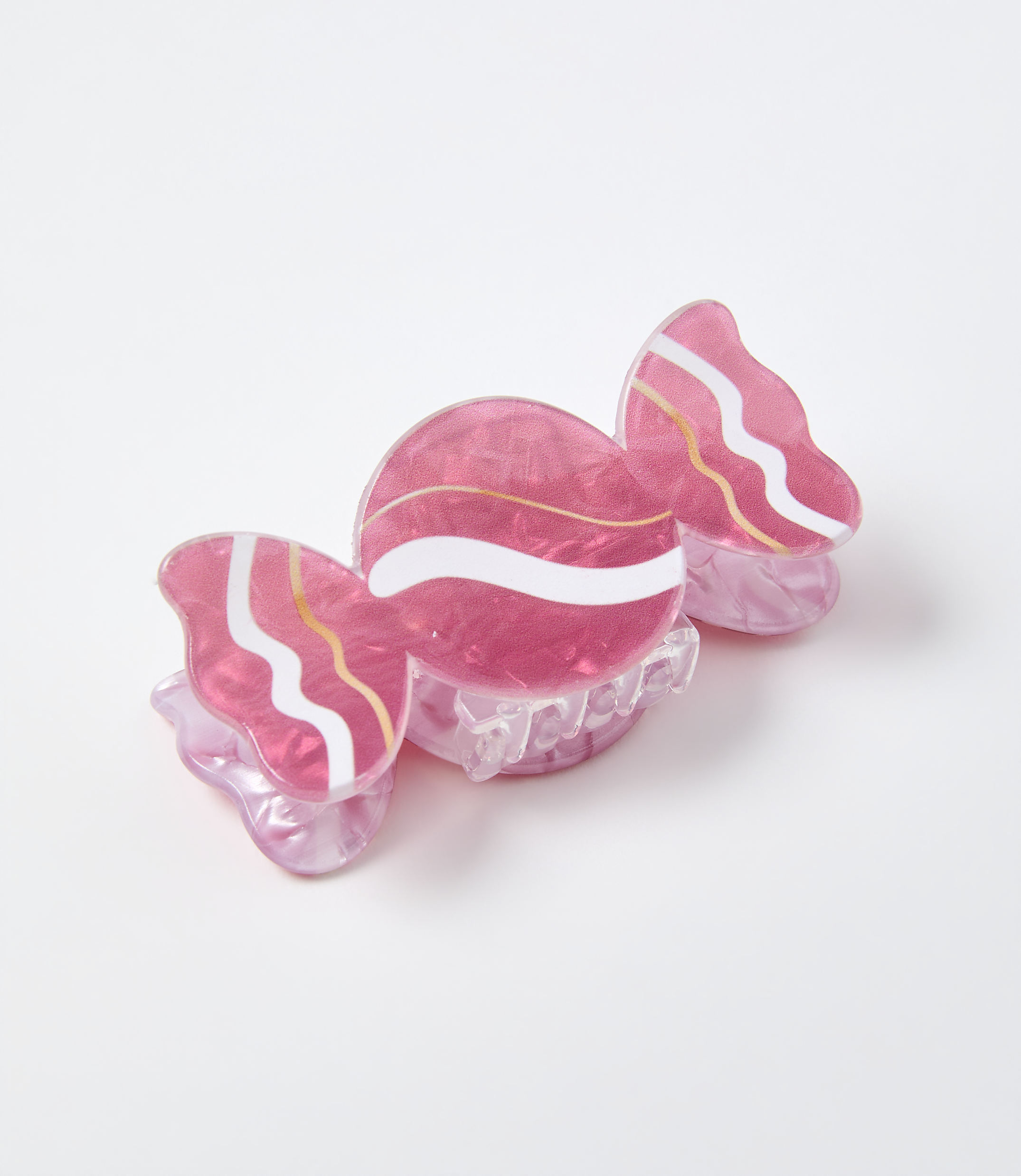 A pink candy-shaped accessory rests on a plain white background.