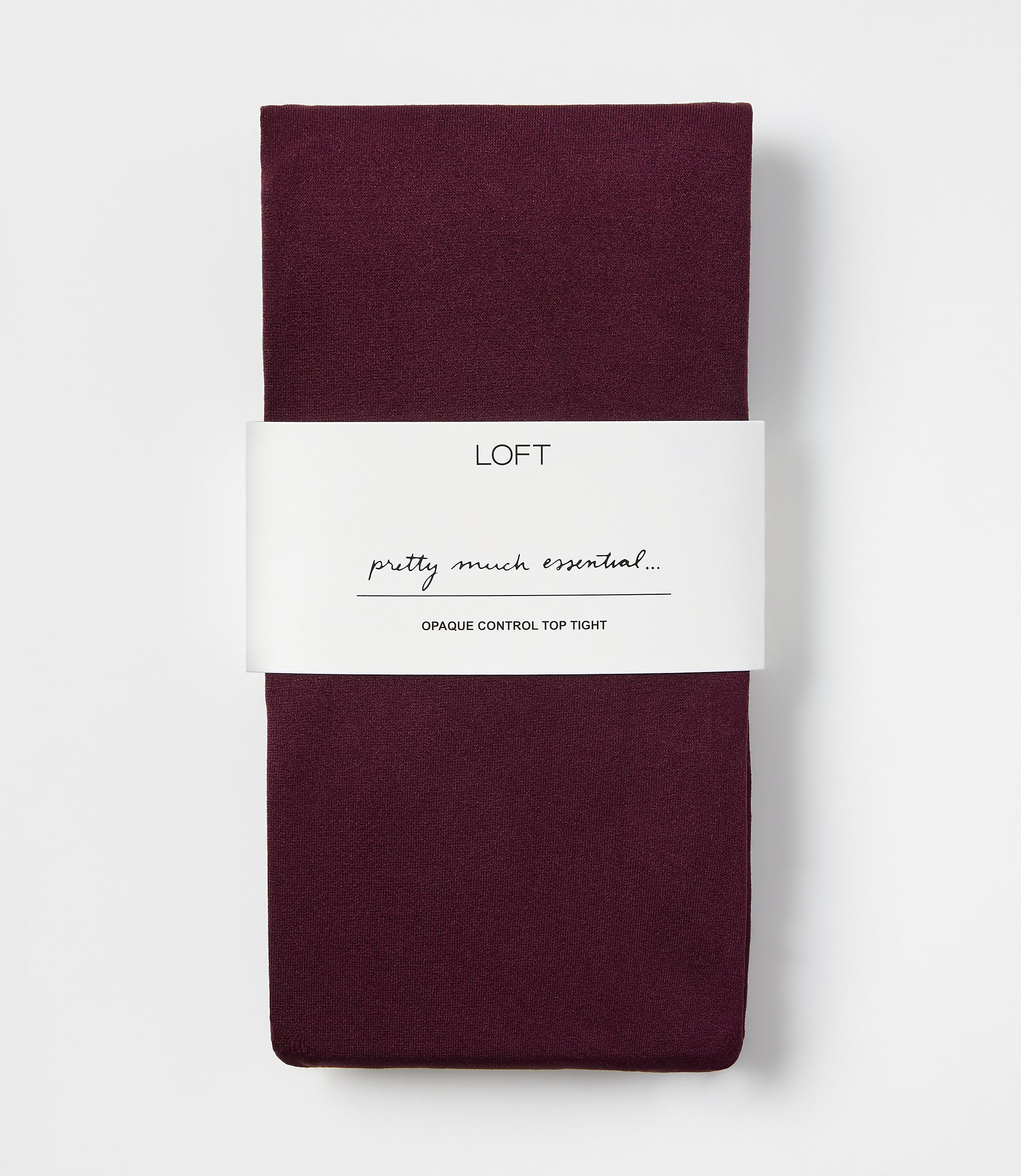 A pair of folded burgundy opaque control top tights with a white LOFT brand label centered against a plain white background.