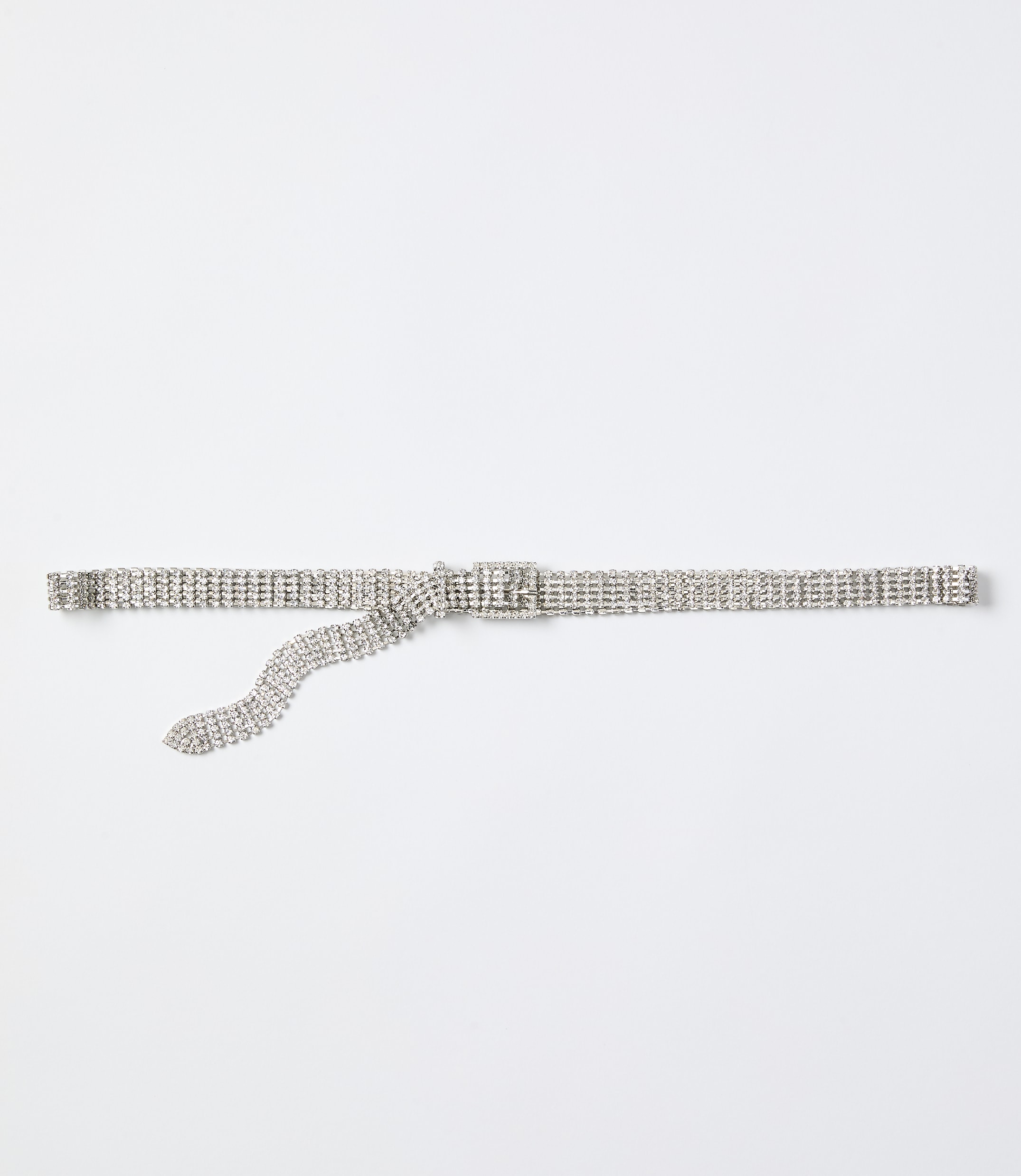 A sparkling rhinestone belt lies horizontally across a plain white background.