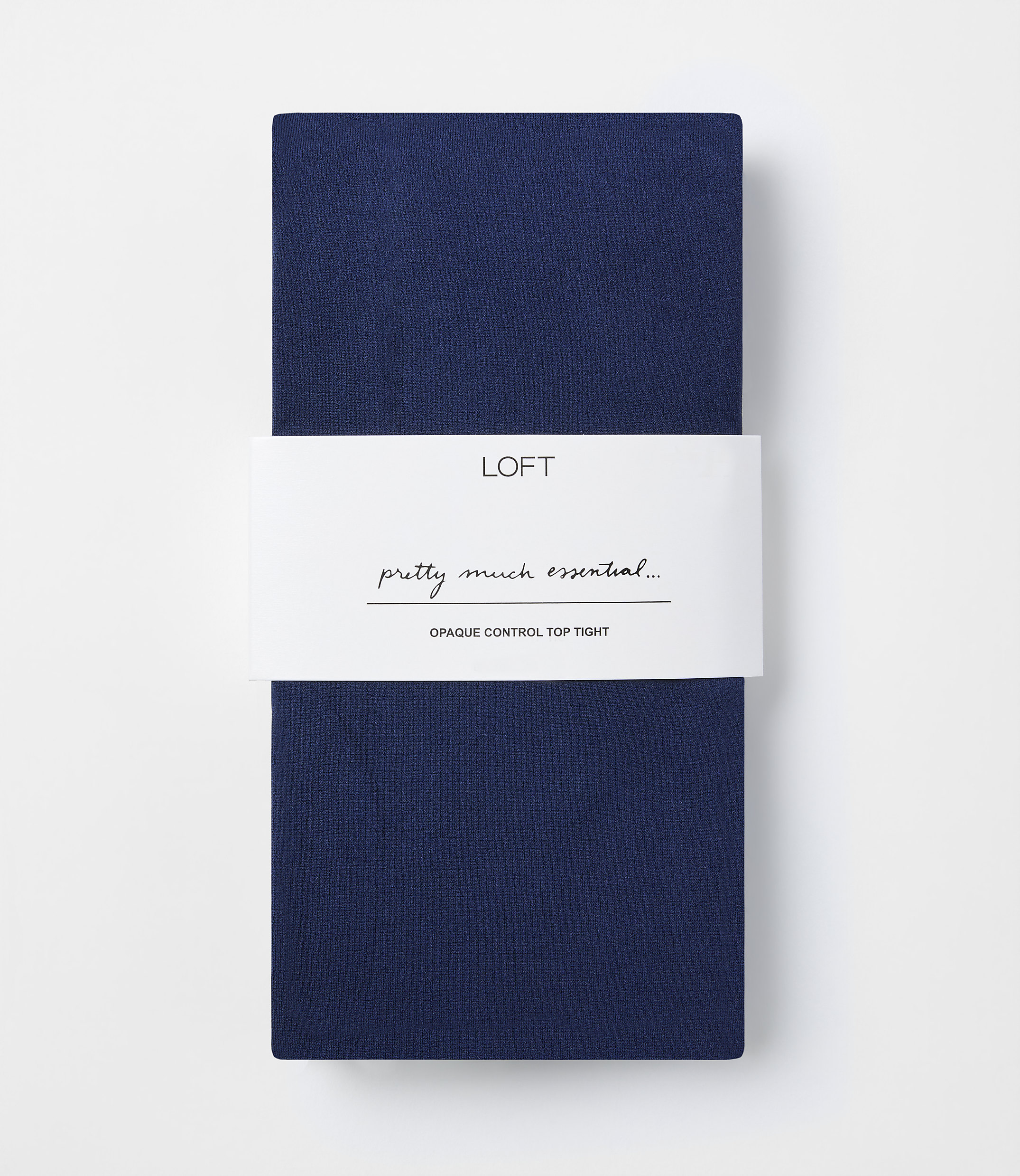 A folded pair of navy blue opaque control top tights with a white band in the middle featuring the "LOFT" logo and text, against a plain white background.