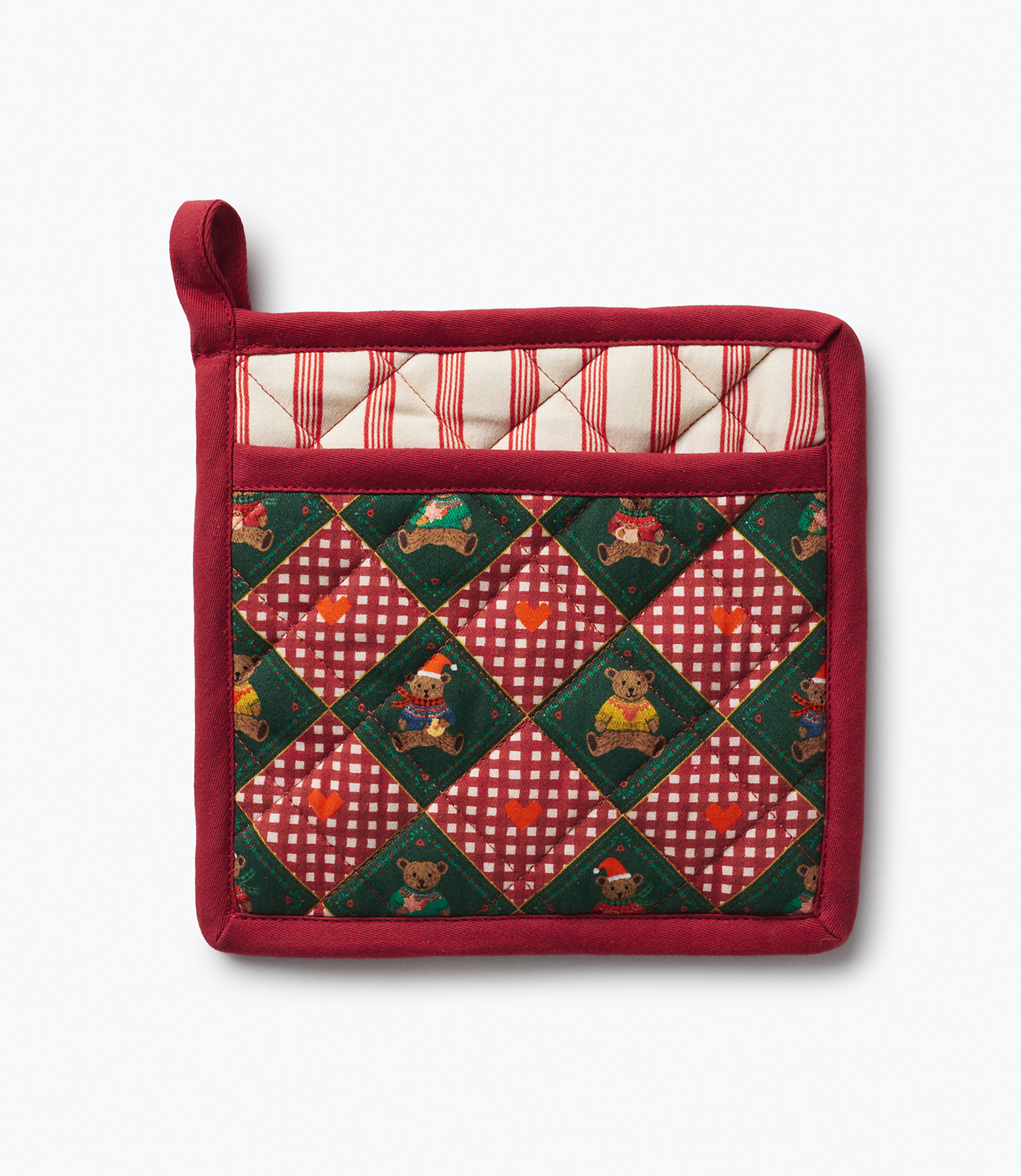 A red quilted pot holder with a teddy bear pattern sits against a plain white background.