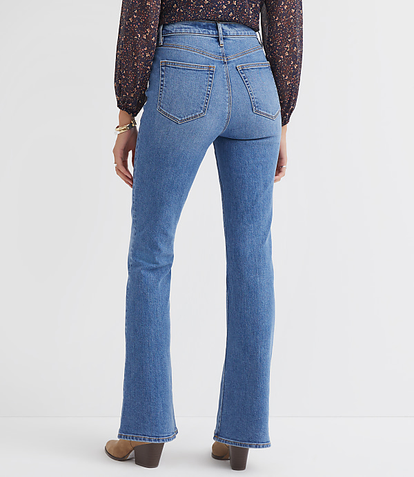 Petite Pintucked High Rise Slim Flare Jeans in Medium Stone Wash