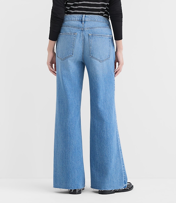 Rivete Petite Fresh Cut Mid Rise Loose Flare Jeans in Light Wash
